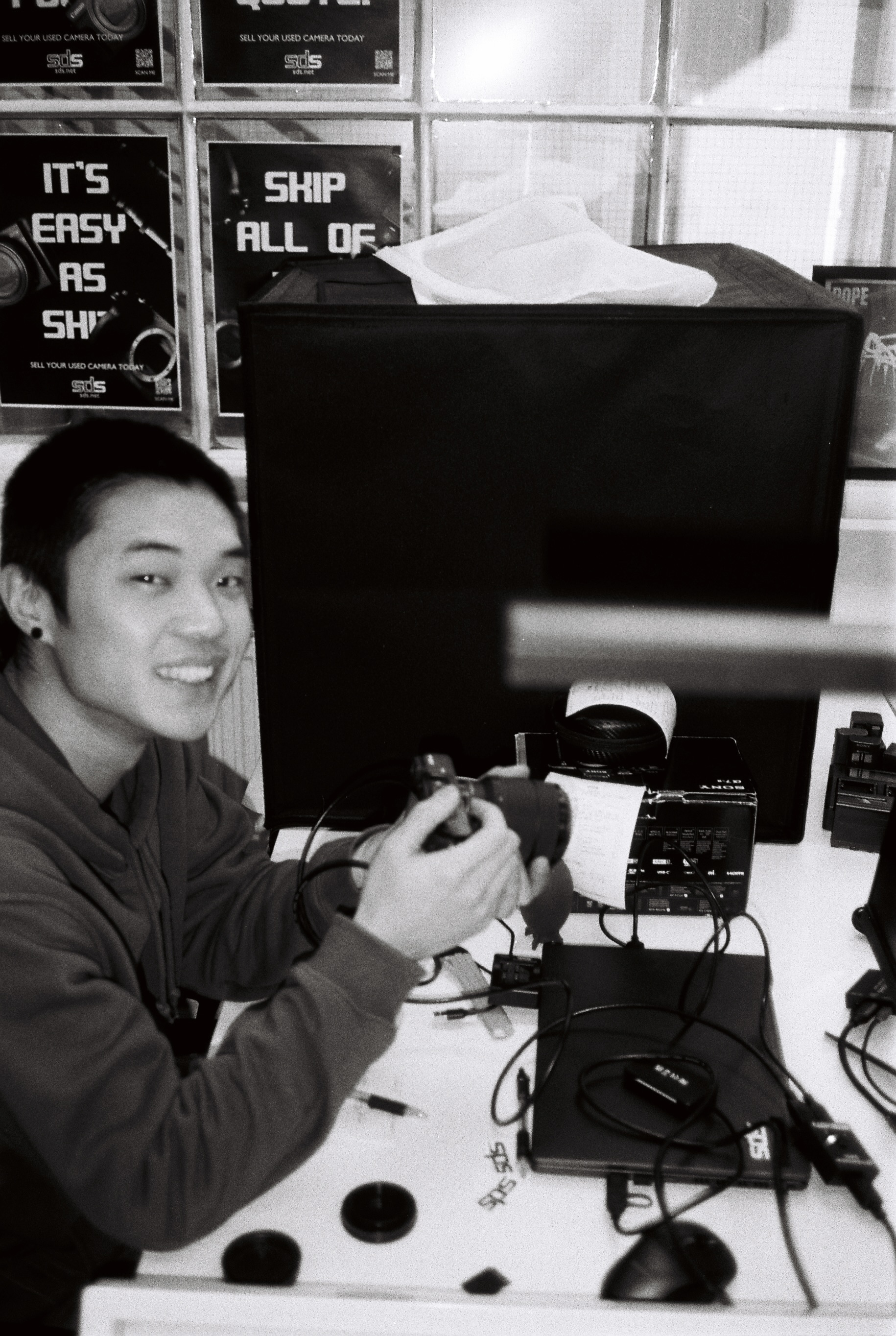 A member of the SDS team testing a customers trade-in camera gear